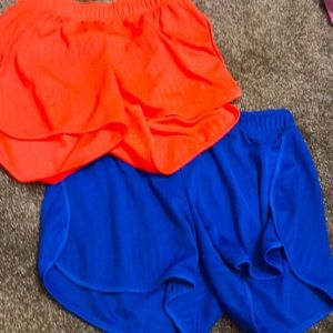 Athletic shorts - colors: pinkish orange- dark blue -size: medium (8-10)